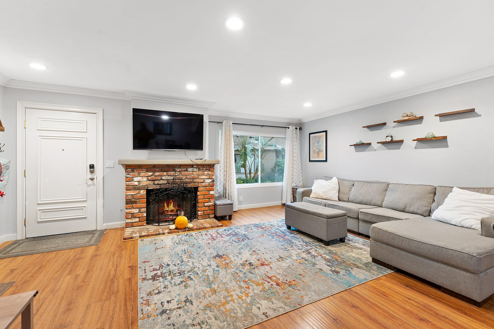 Living room with fireplace and natural light