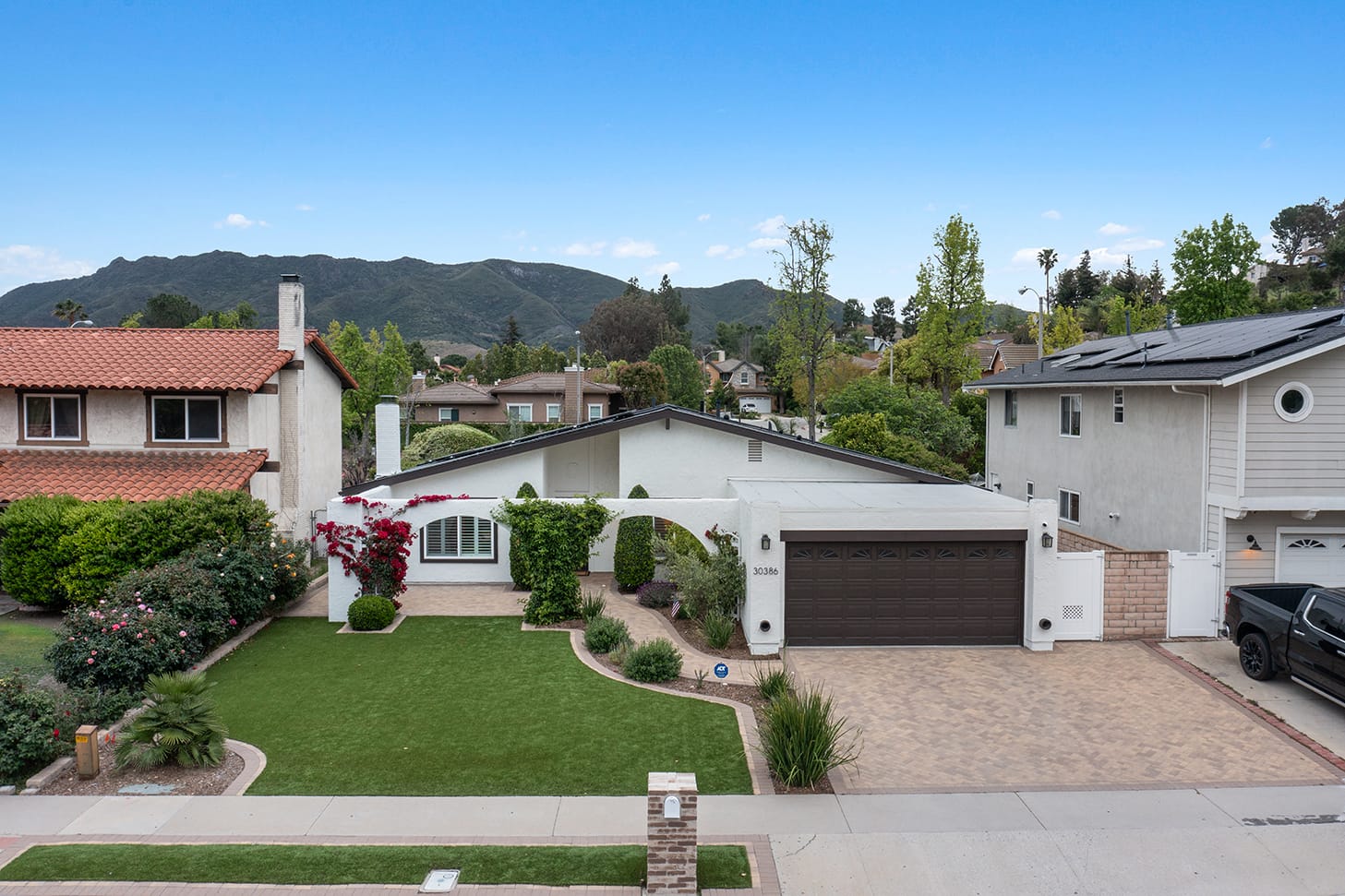 Aerial view of 30386 Rainbow View Drive and Lake Lindero neighborhood