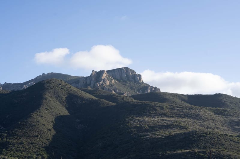 Rocky summit of Boney Mountain rising above chaparral ridges in the Santa Monica Mountains
