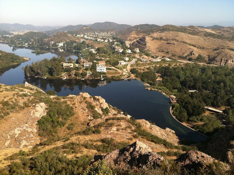 Elevated view of Lake Sherwood and its dam amid the oak covered Santa Monica Mountains