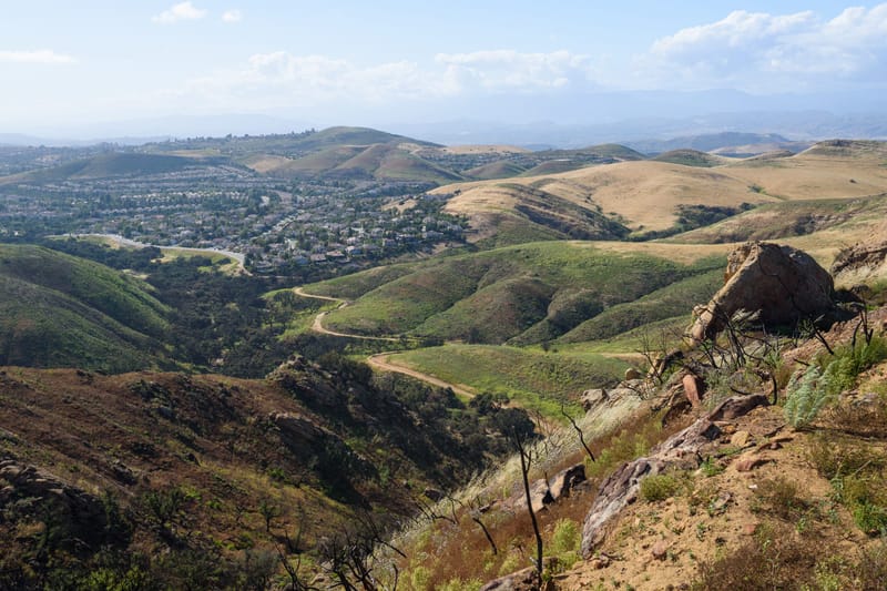 Rolling green hills and winding trail above the Lang Ranch neighborhood in Thousand Oaks