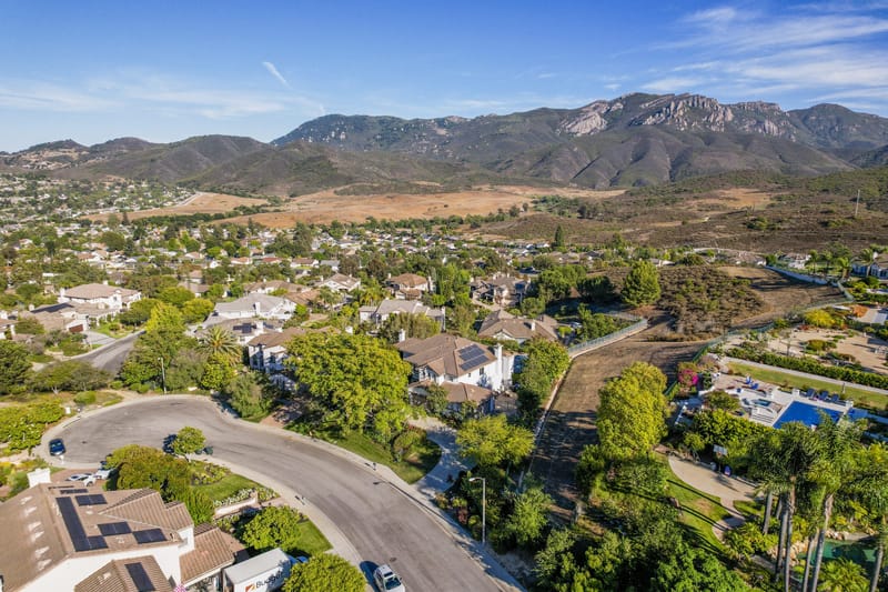Aerial view of a Newbury Park neighborhood with Boney Mountain beyond